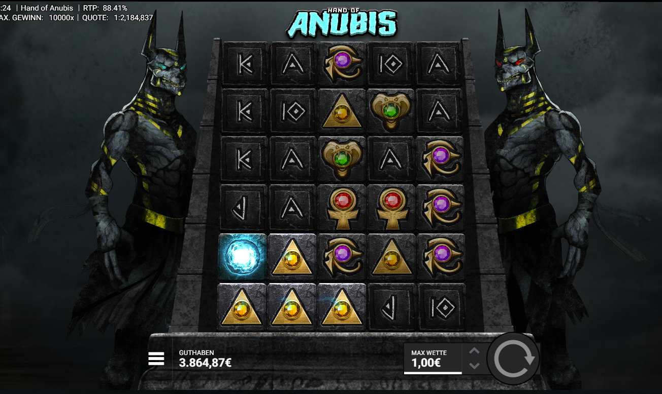 Hand-of-Anubis-Slot mit Symbolraster, Dreieck‑Symbolen und zwei Anubis‑Statuen.